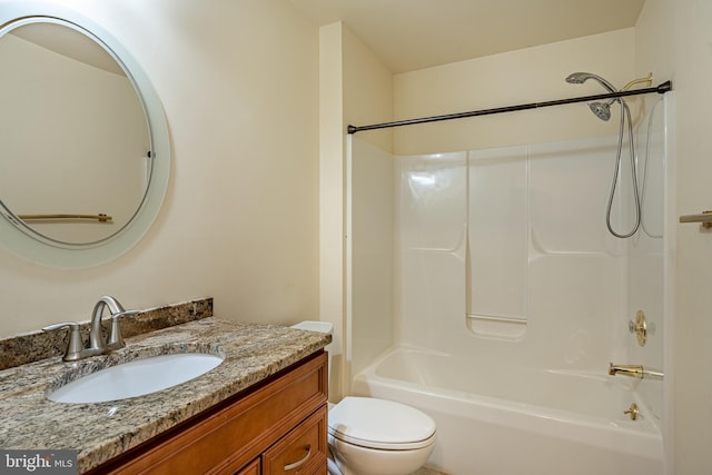 full bathroom featuring vanity, toilet, and washtub / shower combination