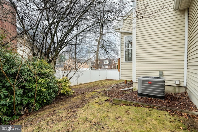 view of yard with central air condition unit