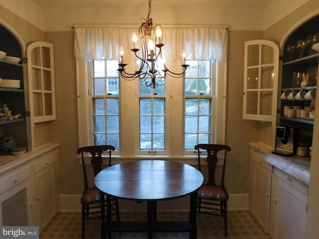 dining area featuring an inviting chandelier