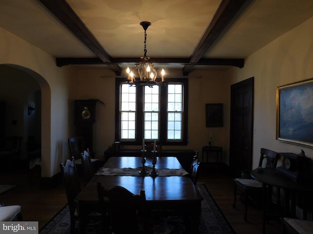 dining area with beamed ceiling, coffered ceiling, a chandelier, and hardwood / wood-style flooring