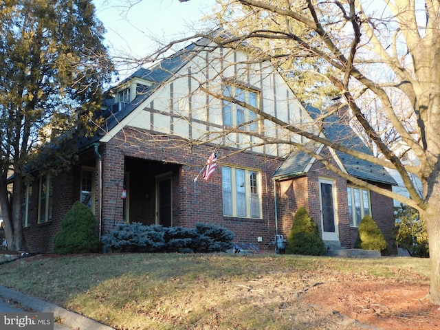 view of home's exterior with a yard