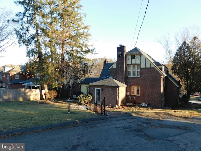 view of home's exterior with a yard