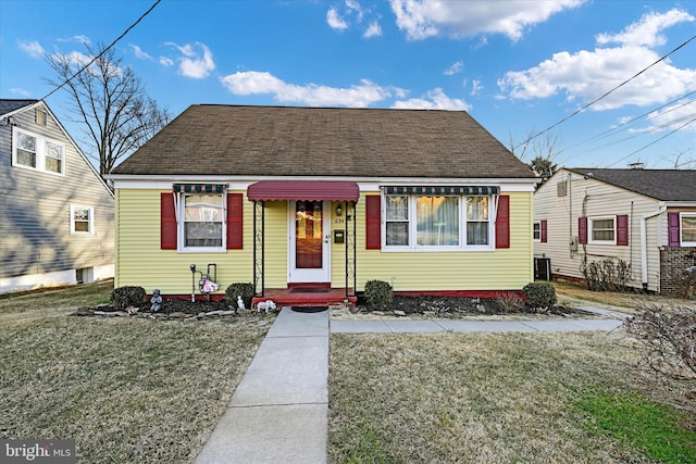 bungalow with central AC and a front lawn