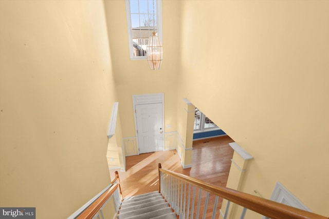 stairs with wood-type flooring