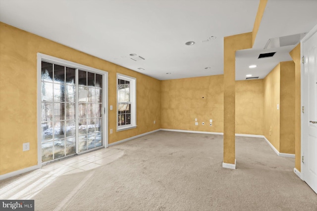 unfurnished room with light colored carpet