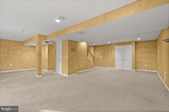 basement with light colored carpet