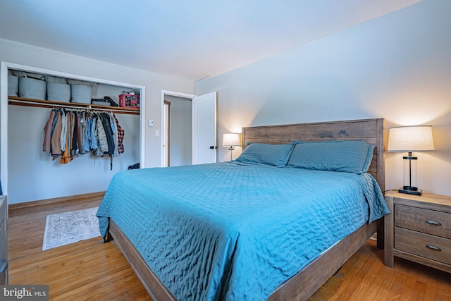 bedroom featuring light hardwood / wood-style flooring and a closet