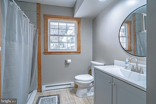 bathroom featuring walk in shower, vanity, baseboard heating, and toilet