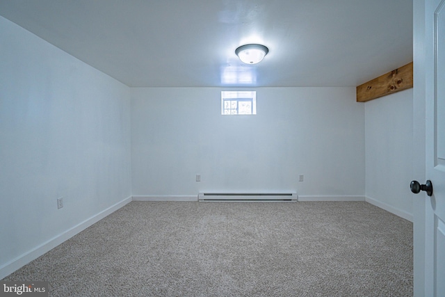 basement with carpet and a baseboard heating unit