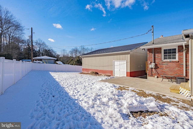 yard layered in snow featuring cooling unit