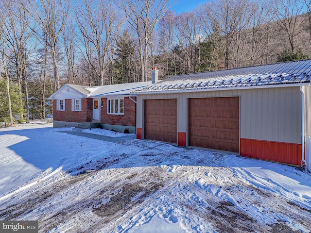 ranch-style house featuring a garage