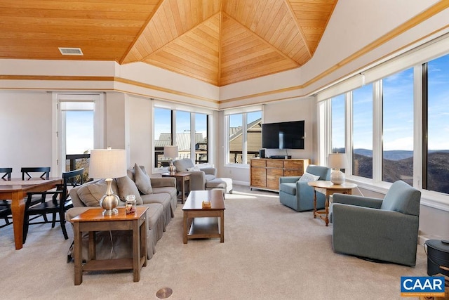 living room featuring a towering ceiling, light carpet, and wood ceiling