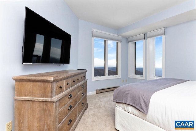 carpeted bedroom with a baseboard radiator