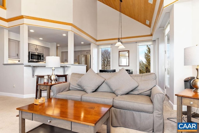 carpeted living room featuring a high ceiling