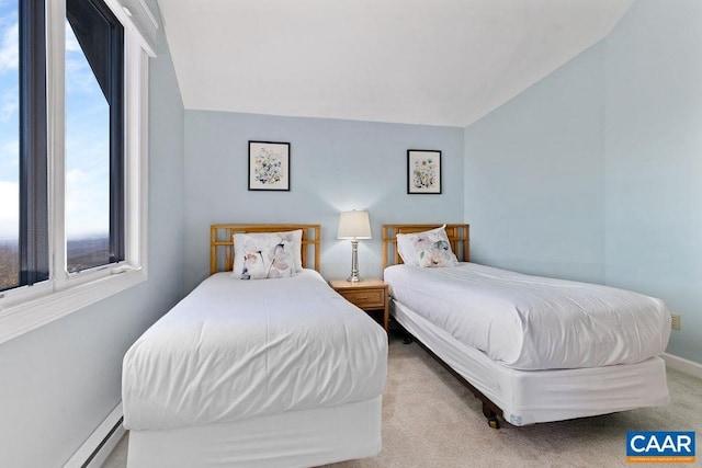 bedroom with lofted ceiling, light carpet, multiple windows, and a baseboard heating unit