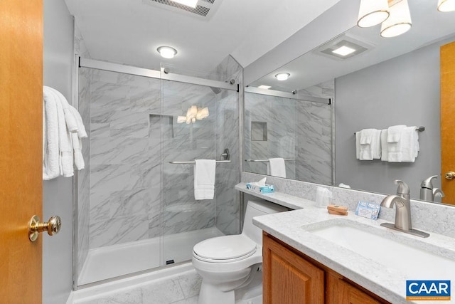 bathroom with vanity, toilet, and walk in shower