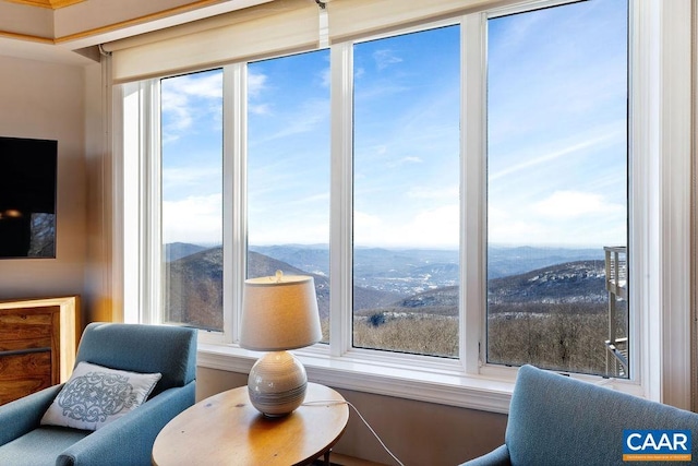 sitting room featuring a mountain view