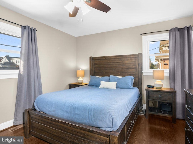 bedroom featuring dark wood-type flooring and ceiling fan