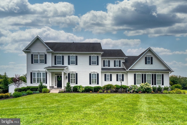 view of front facade featuring a front yard