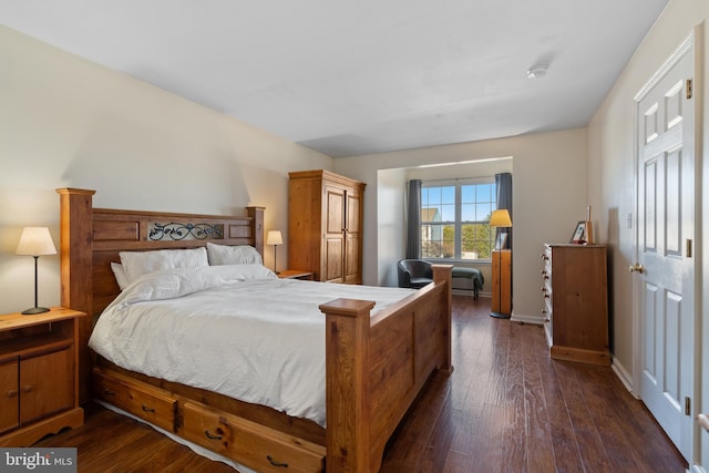 bedroom featuring dark hardwood / wood-style flooring