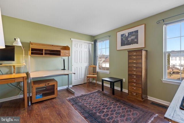 interior space featuring dark wood-type flooring and a closet