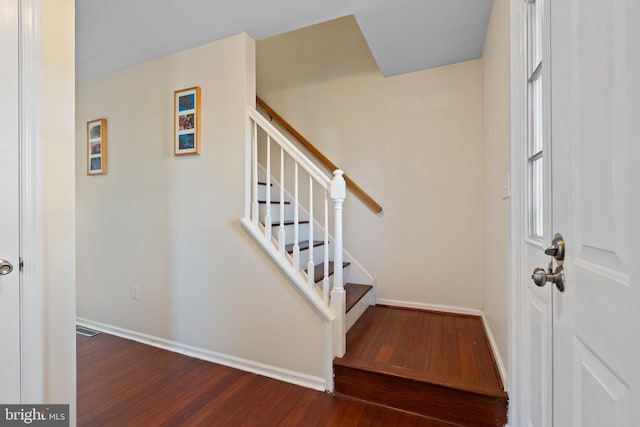 stairs with hardwood / wood-style flooring