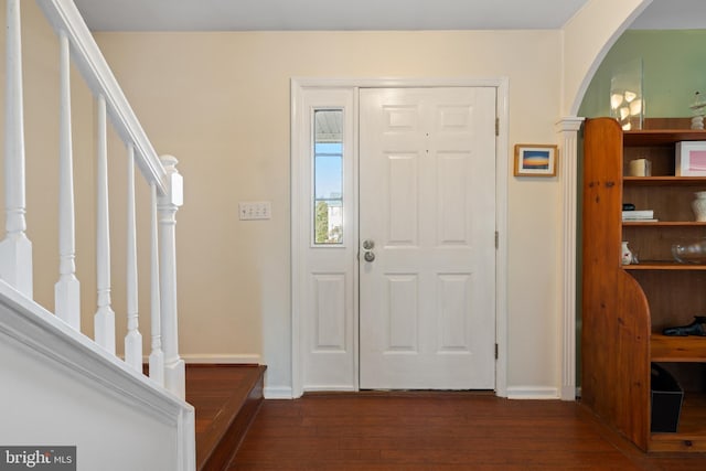 entrance foyer featuring dark hardwood / wood-style flooring