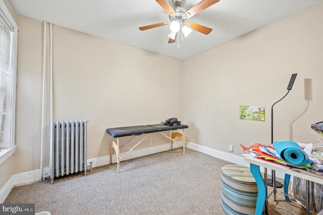 miscellaneous room featuring ceiling fan, carpet flooring, and radiator