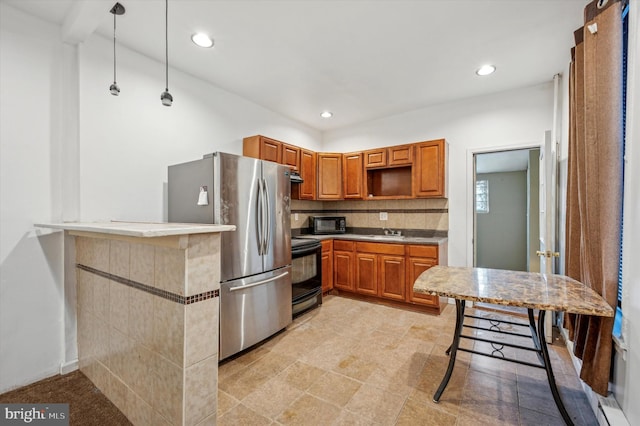 kitchen featuring sink, tasteful backsplash, decorative light fixtures, kitchen peninsula, and black appliances