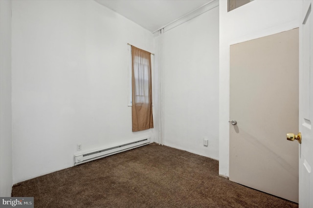 carpeted spare room featuring a baseboard radiator