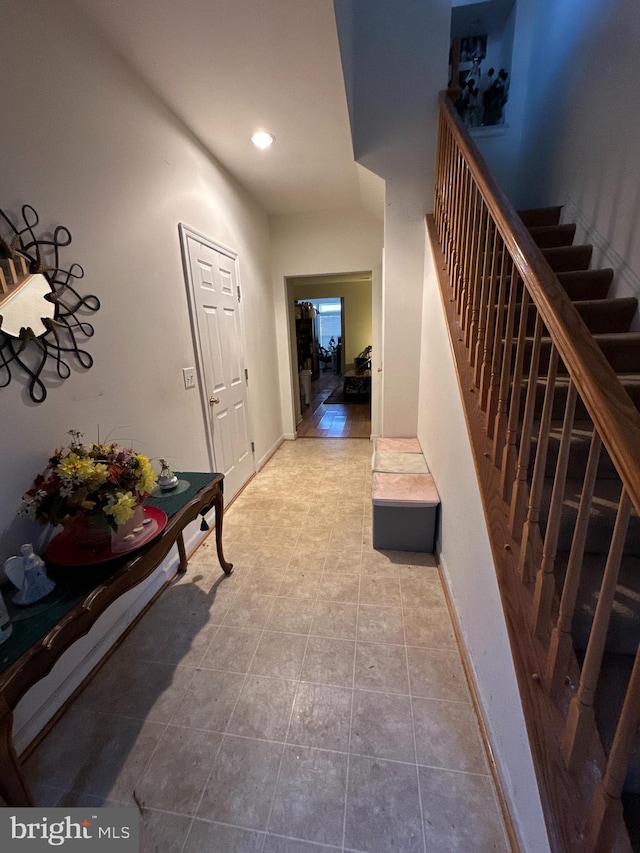 corridor featuring light tile patterned flooring