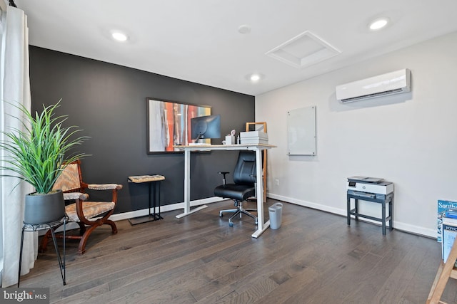 home office with dark hardwood / wood-style floors and a wall unit AC