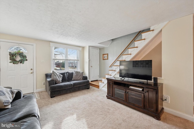 carpeted living room with a textured ceiling