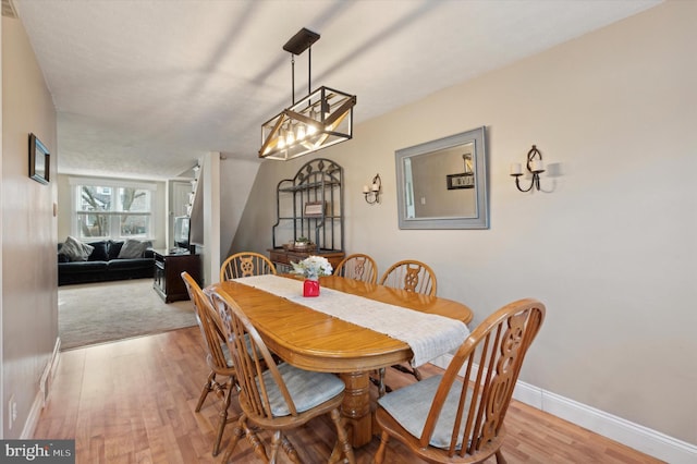 dining room with light wood-type flooring