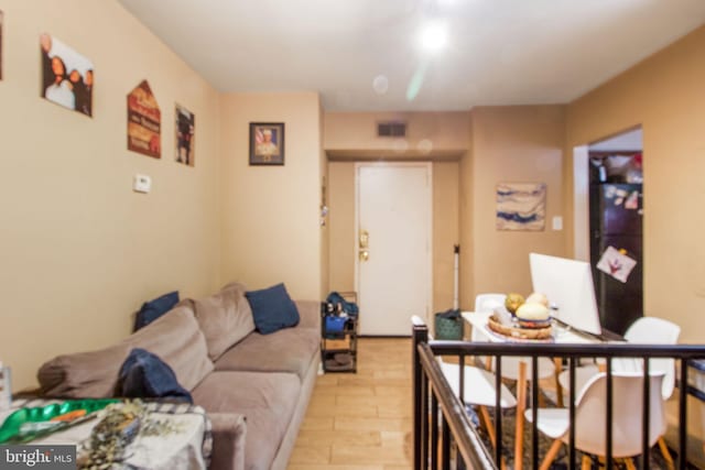 living room with light hardwood / wood-style floors