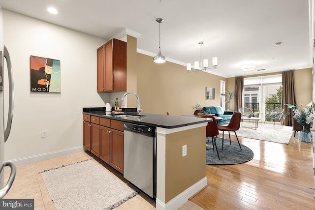 kitchen with sink, hanging light fixtures, dishwasher, kitchen peninsula, and a notable chandelier