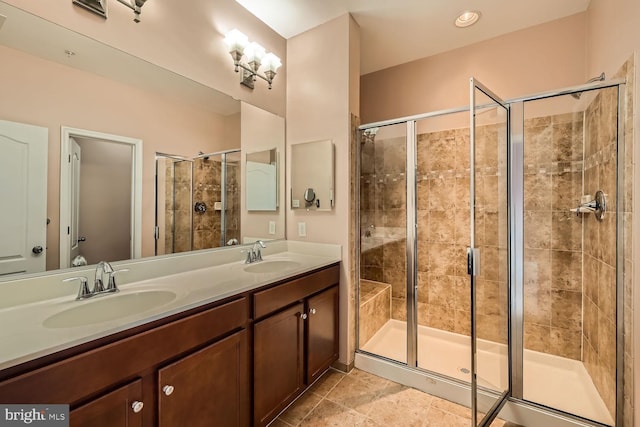 bathroom featuring vanity and a shower with door