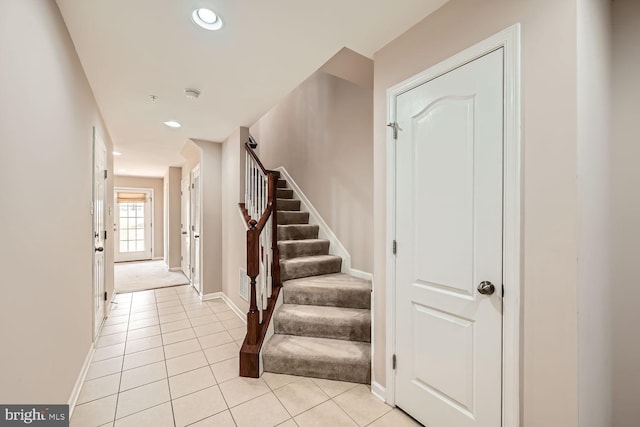 staircase with tile patterned floors