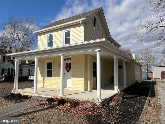 farmhouse-style home featuring a porch