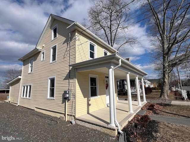 view of home's exterior featuring a porch