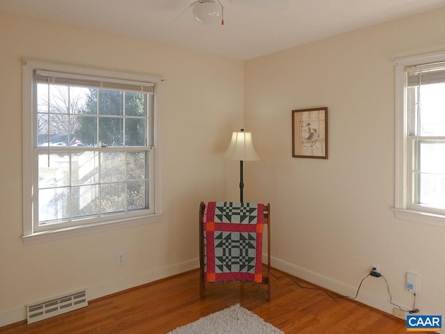 unfurnished room with hardwood / wood-style floors