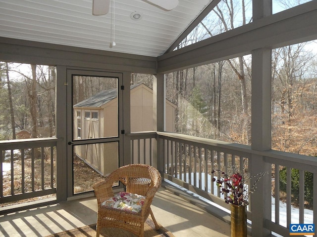 sunroom with vaulted ceiling and ceiling fan