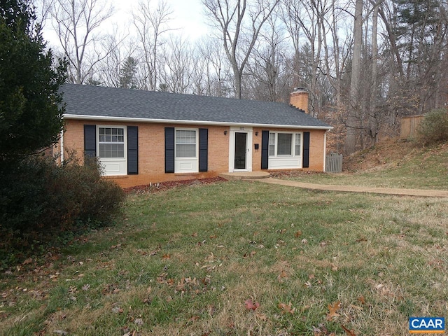 ranch-style house featuring a front lawn