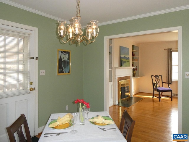 dining area featuring crown molding and wood-type flooring