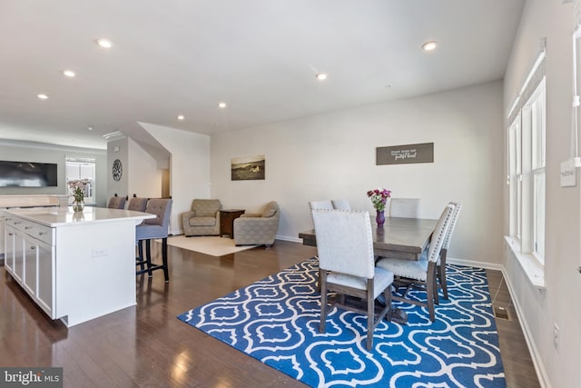 dining area with dark wood-type flooring