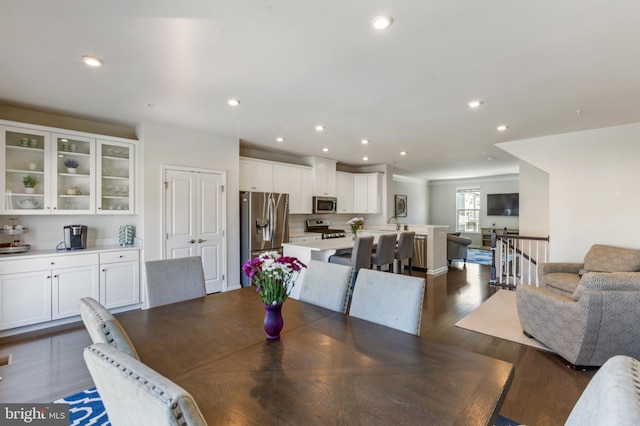 dining area with dark wood-type flooring