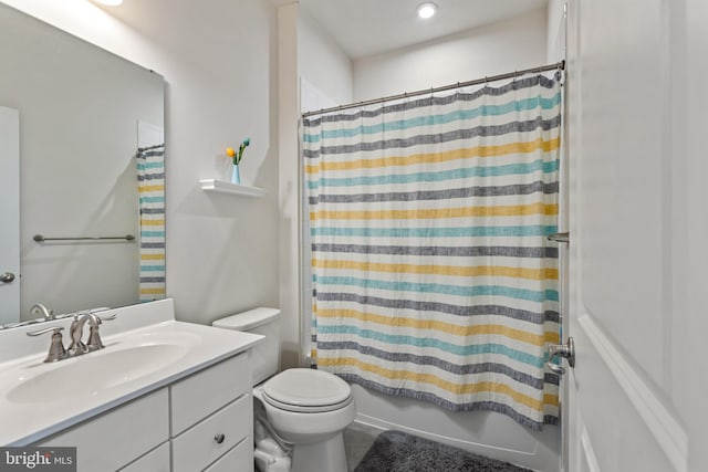 full bathroom with vanity, toilet, and shower / bath combo with shower curtain