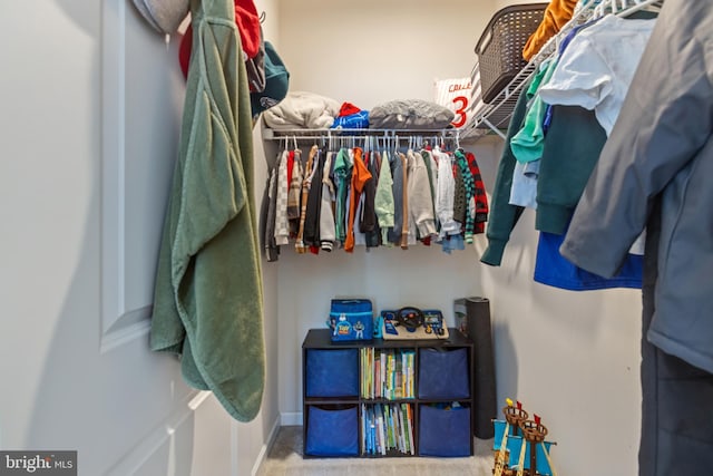 walk in closet with carpet