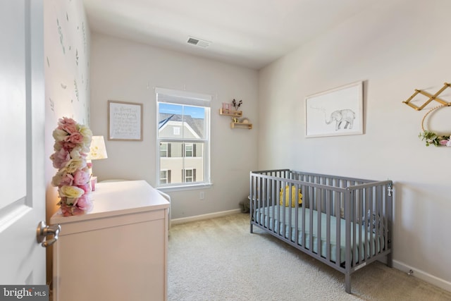 bedroom featuring light colored carpet