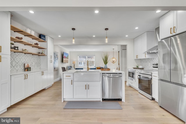 kitchen with pendant lighting, open shelves, light countertops, appliances with stainless steel finishes, and white cabinetry